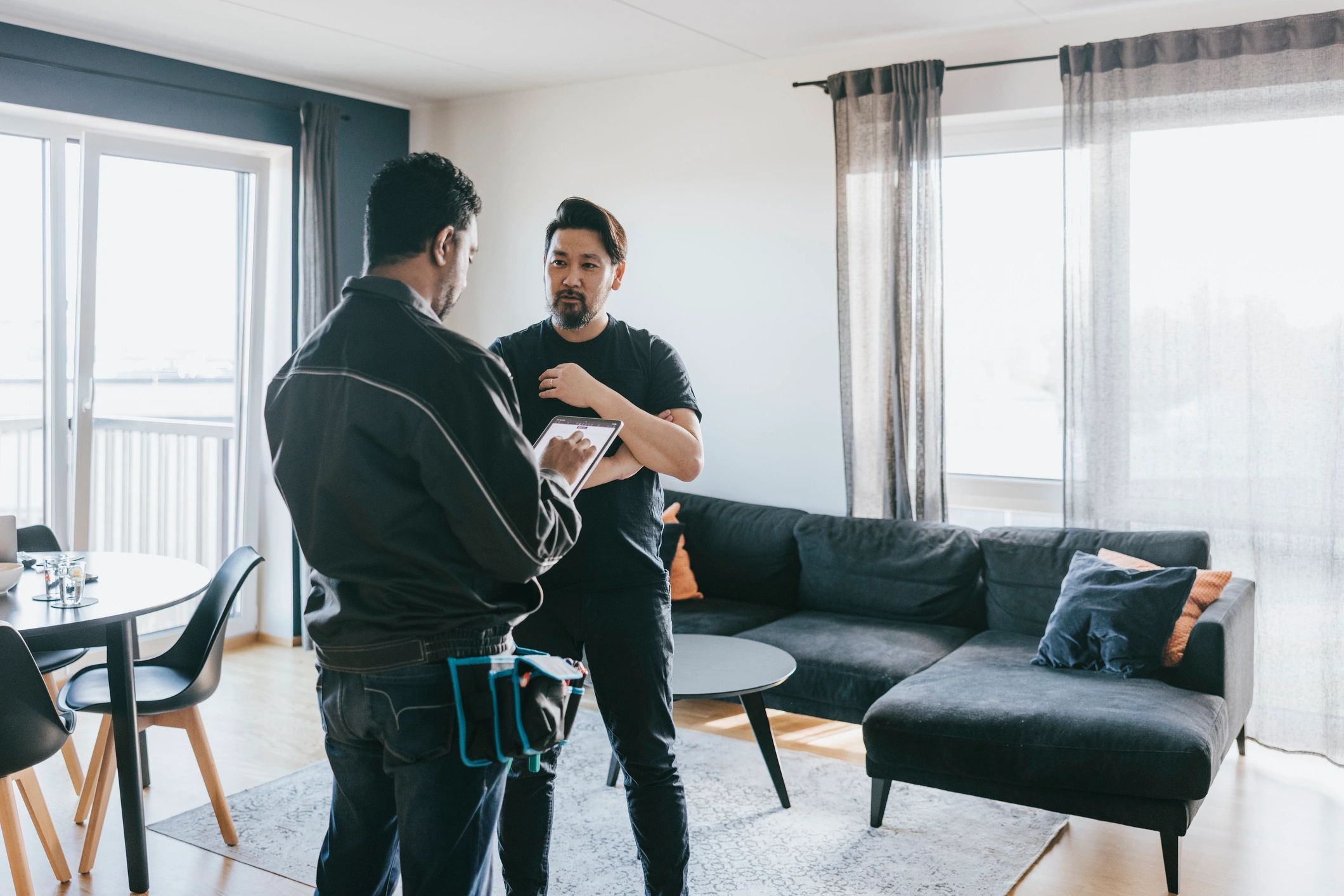 Technician discussing project details with a homeowner