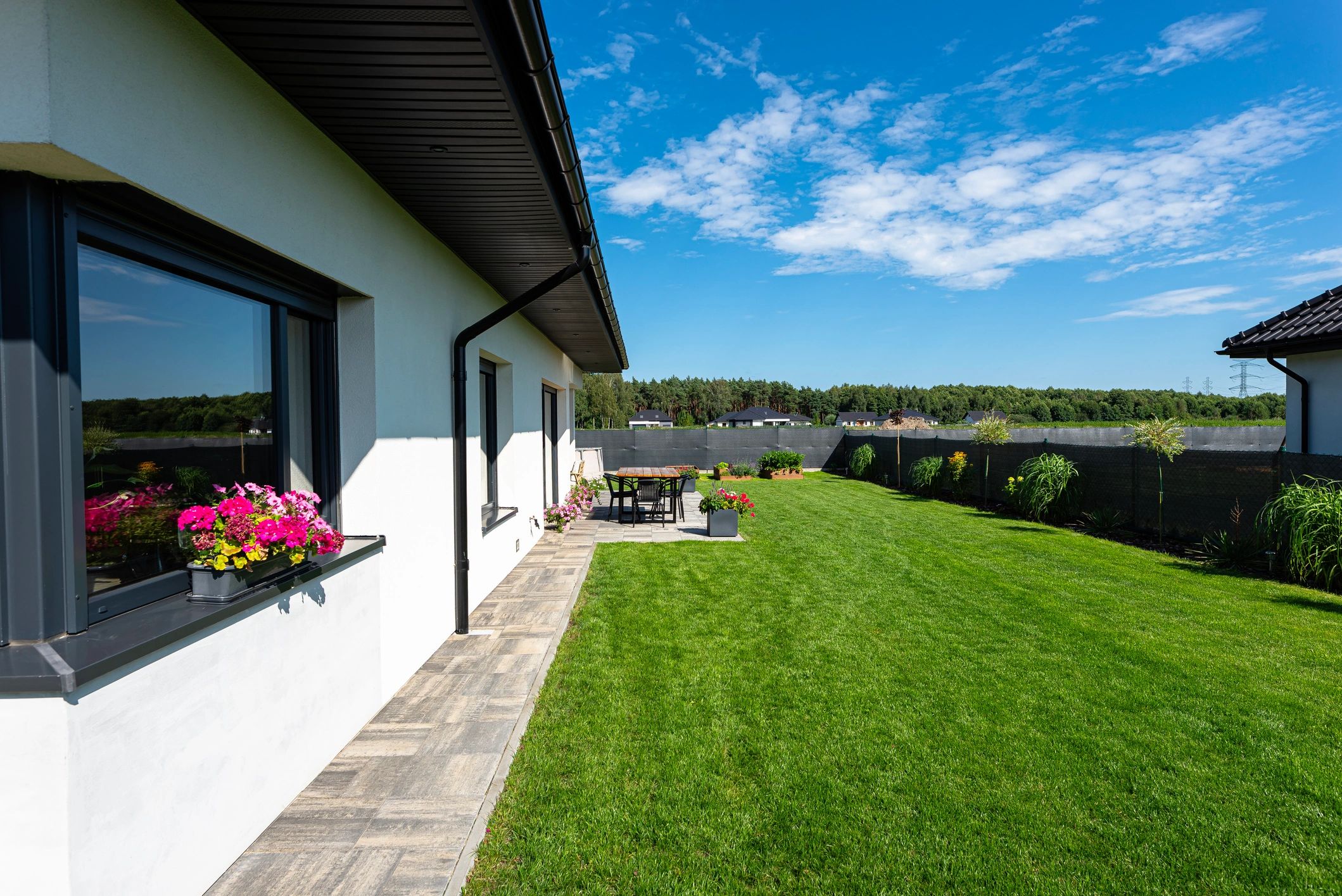 Energy-efficient home exterior with yard