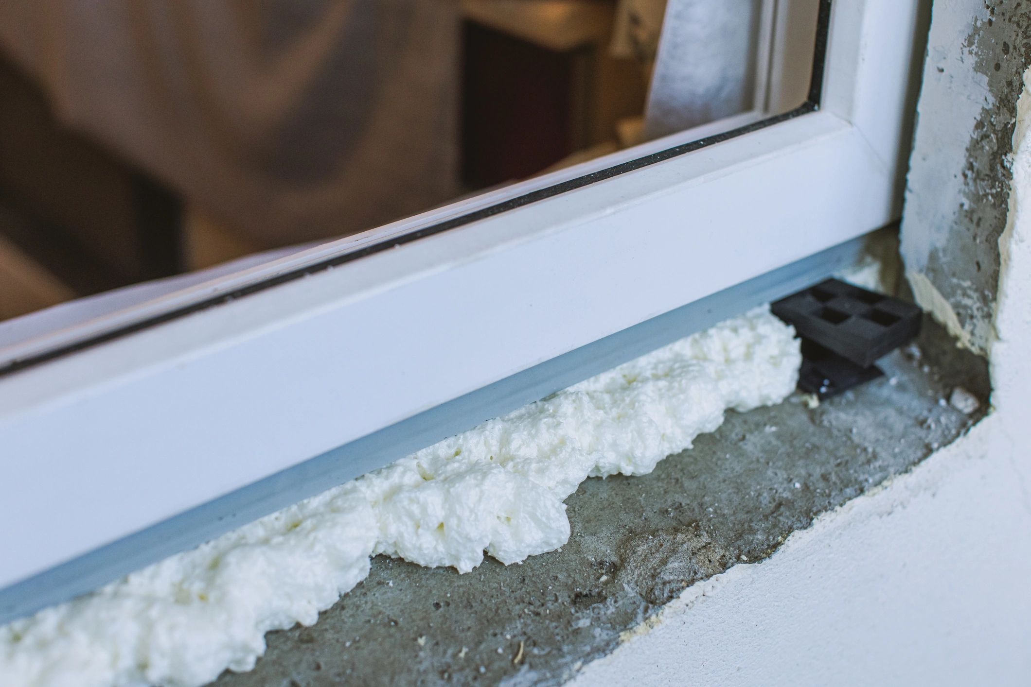 Foam sealing around a window frame to reduce air leakage
