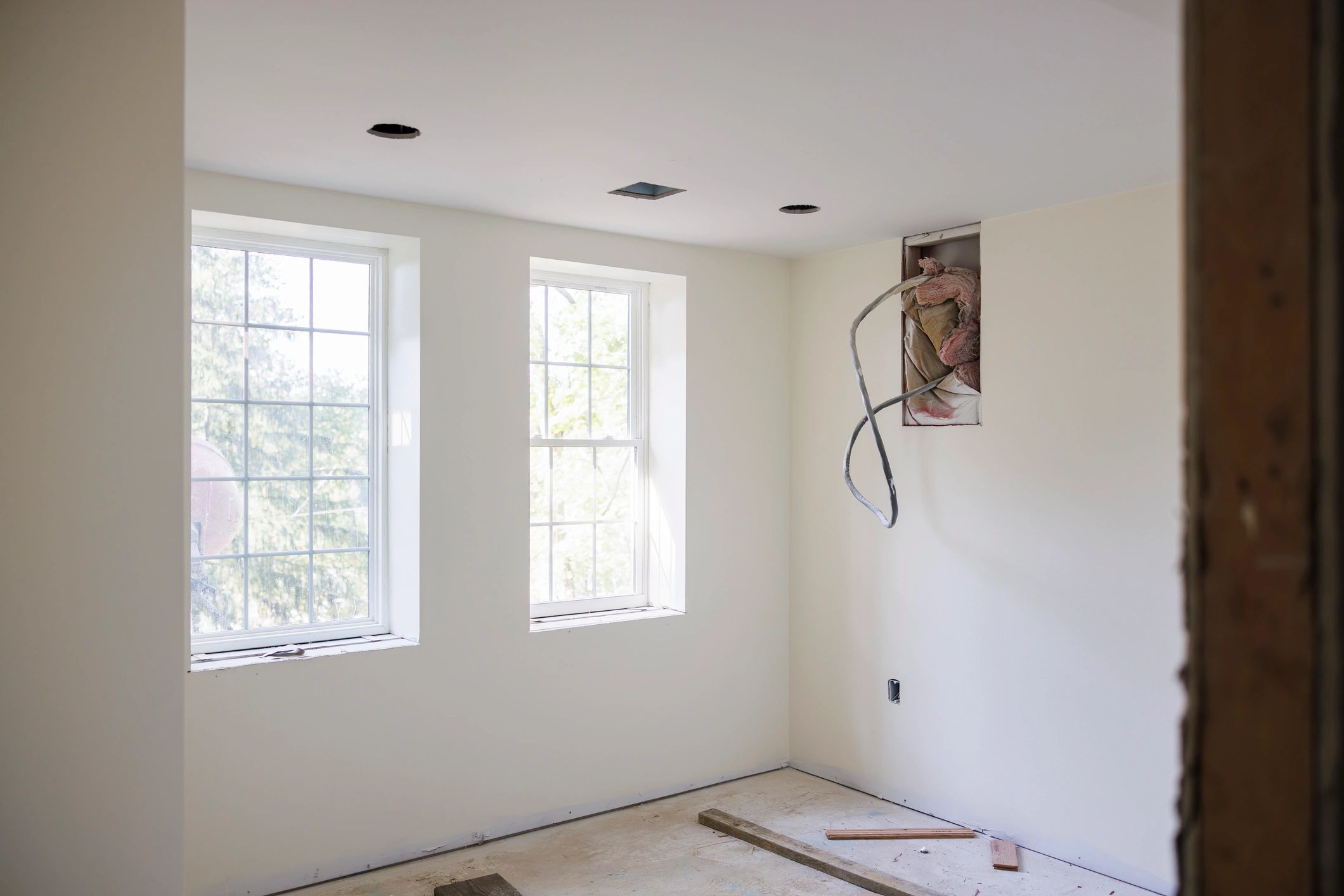 Bright renovated home interior with large windows